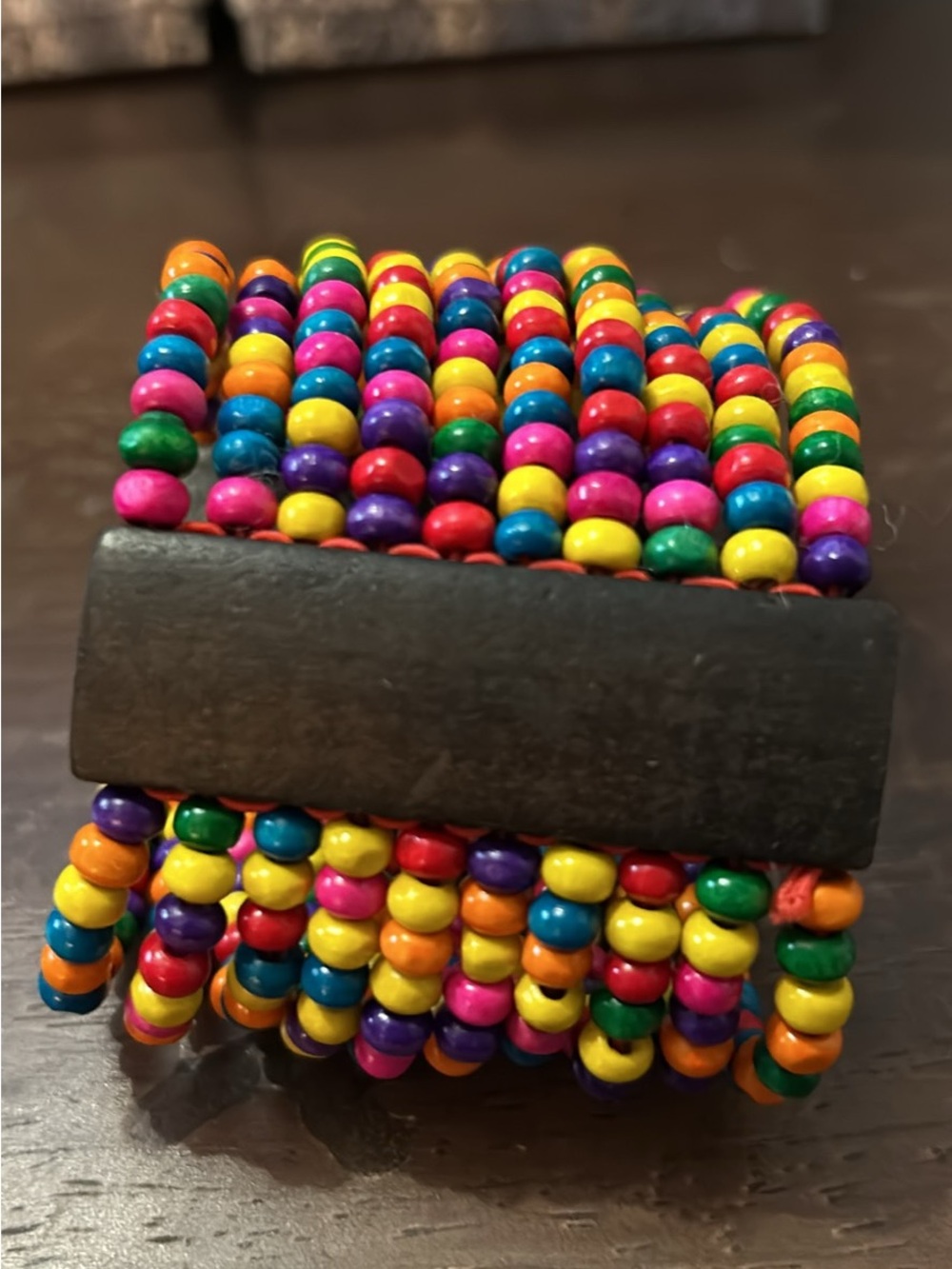 Bright Multistrand Beaded Stretch Bracelet with Dark Wooden Bar